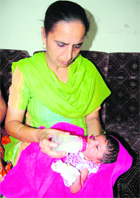 The baby in care of a volunteer.