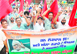 Activists of NRMU stage a march in support of Anna Hazare in Amritsar on Thursday.