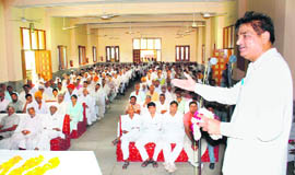 SJP president Raghu Yadav addresses a Mahapanchayat in Rewari. 