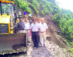 DC C Palrasu, Kasauli MLA Dr Rajiv Sehzal and other officials inspect the damaged Kamli-Bhojnagar road near Parwanoo on Thursday