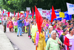 Women hold a protest march against the Micro-Hydel Power Project in Manali on Thursday