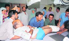 An injured in a grenade attack at Batamaloo in Srinagar on Thursday undergoes treatment at the SMHS hospital