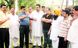 Members of the Jalandhar Cantonment Board discuss the Armys move