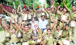 NCC cadets of Government Model Senior Secondary School, Ladowali Road, in a jubilant mood after receiving a trophy during a NCC camp held by 19 Dogra Regiment in Jalandhar Cantonment