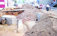 Debris being used to fill up a crater instead of sandy soil in Ludhiana on Thursday