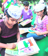 Children participate in a painting competition held near Union Minister Pawan Kumar Bansals house in Sector 28, Chandigarh, on Friday