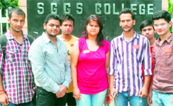 Vasudha Sharma, the first female presidential candidate in a co-educational college, poses with her friends outside SGGS College, Sector 26