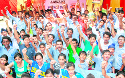 Students of Government Model School, Sector 37, stage a protest near Sectors 7 and 8 roundabout in Chandigarh