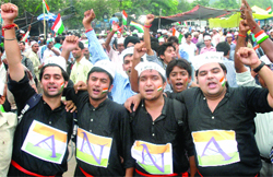 Anna Hazares supporters shout slogans on the 11th day of his hunger strike at the Ramlila Ground in New Delhi on Friday. 