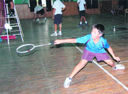 A player in action in the Dehradun District Badminton Championship in Dehradun on Friday.