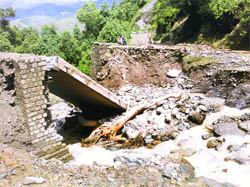 A bridge on a road in the Sirhkund area in Chamba district that was damaged by the recent heavy rain