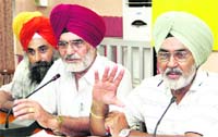Members of the Punjab Government Transport Workers Union address a press conference in Jalandhar