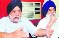 DSGMC chief PS Sarna (L) in Amritsar