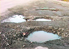 Most of the roads are broken, potholed and waterlogged. These conditions damage vehicles and obstruct the smooth flow of traffic