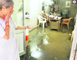 Social Welfare Minister Laxmi Kanta Chawla expresses shock after water entered her office in Amritsar. 