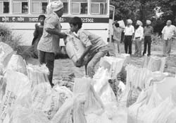 Ashes of unclaimed bodies being loaded in a funeral van for immersion at Kiratpur Sahib.