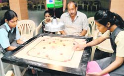 Players in action during the 14th St Stephens Carrom Ranking Tournament at St Stephens School, Sector 45, Chandigarh,