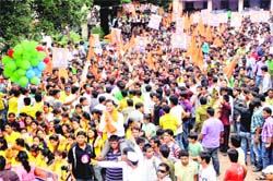 A candidate goes in procession to file his nomination papers for the students council elections of DAV PG College, Dehradun
