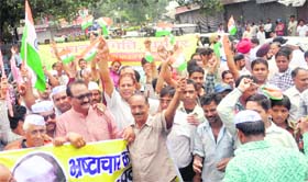 Traders hold a demonstration against corruption at the Clock Tower in Dehradun on Saturday.