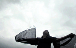 A girl stretches her arms to feel the breeze in Jalandhar on Saturday