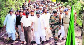 Accompanied by Army and civil administration officers, residents of Kerni village, near the LoC, in Poonch district return home on Friday.