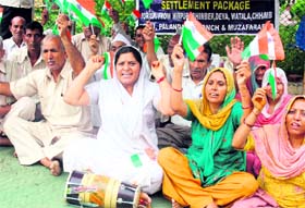 Members of the Refugees Association hold a dharna at Mubarak Mandi Complex.