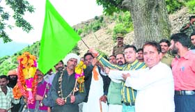 KC Bhagat, MLA Chenani, (right) flags off the Kailash Kund yatra in Udhampur on Friday.