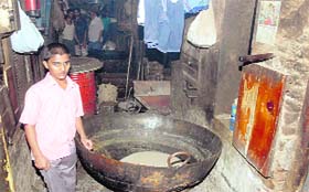 A cauldron in which a worker of the sweetmeat shop accidentally fell and sustained serious burns.