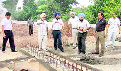 Officiating MC Commissioner (fourth from left) inspects work on Partap Chowk flyover in Ludhiana on Saturday