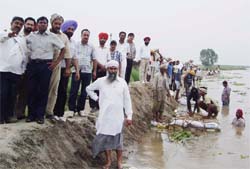 DC S Karuna Raju inspecting the strengthening work of spurs in DT Mal area on Sunday. 