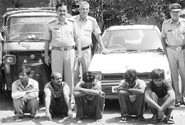 Accused in police custody, along with stolen vehicles, at Panchkula on Sunday. 