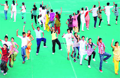 School students make a formation during a dance rehearsal for the National Sports Day celebrations at the Sector-42 Hockey Stadium in Chandigarh on Sunday