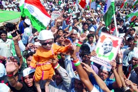 People celebrate as Anna Hazare breaks his fast at the Ramlila Maidan in New Delhi on Sunday.