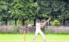 A batsman plays a shot during the the PCA Players Emerging Cricket Tournament in Ludhiana on Sunday. 