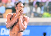 Jamaicas Usain Bolt walks out after being disqualified for a false start during the men's 100 metres final at the IAAF World Championships in Daegu on Sunday.