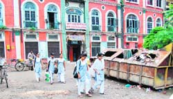 A garbage dump at the entrance of Arya Girls Senior Secondary School, Lahori Gate, poses a health threat to schoolchildren
