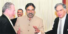 Commerce and Industry Minister Anand Sharma looks on as Rob Davies, Minister of Trade, South Africa, shakes hands with Tata Sons Chairman Ratan Tata at the India-South Africa CEO Forum in New Delhi on Monday