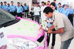 Parveen Singh, general manager of Eakansh Wheels, launches the new Swift at its showroom at Tepla.