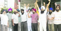 Members of Sikh organisations protest in front of the Divisional Commissioners office in Jammu on Monday against godman Ashutosh Maharajs proposed visit