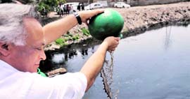 A file photo of the Union Minister for Environment Jairam Ramesh releasing microbial culture into the Budha Nullah at Haibowal Kalan in Ludhiana.