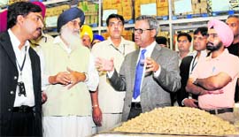 Punjab Chief Minister Parkash Singh Badal at a wholesale outlet in Ludhiana on Monday.