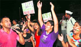 Supporters of social activist Anna Hazare rejoice after Parliament unanimous acceptance of the three key demands of the Jan Lokpal Bill in Ludhiana.