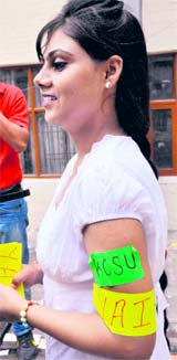 A supporter campaigns for her party at SGGSC-26, Chandigarh.
