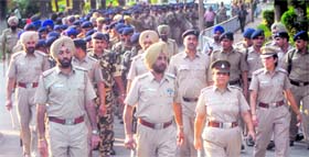 The UT police takes out a flag march at Panjab University on Tuesday.