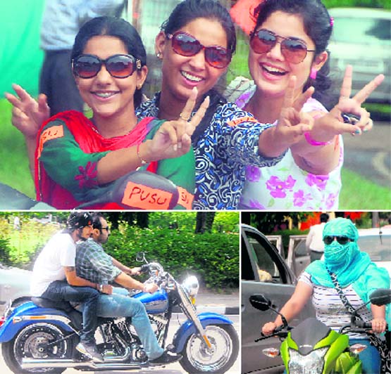 PUSU supporters enjoy a ride; boys ride a swanky mobike; and a girl proves that she is in no way behind boys by riding a mobike at Panjab University on Tuesday. 