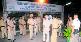 Cops keep a vigil outside a Panjab University hostel ahead of the student polls.