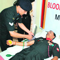 Lt Gen AK Chaudhary donates blood at a camp at Yol near Dharamsala on Tuesday. 