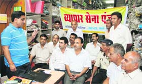 Ravindra Dhir, state president of Vyapar Sena, addresses businessmen at a meeting in Jalandhar