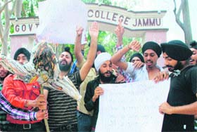 Students protests in front of the MAM College in Jammu on Tuesday