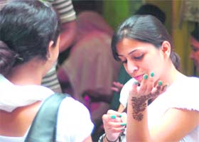 A girl with henna applied on her hand on the eve of Eid-ul-Fitr in Jammu on Tuesday